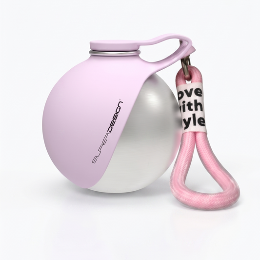 Pink and white pet toy with a keychain on a white background